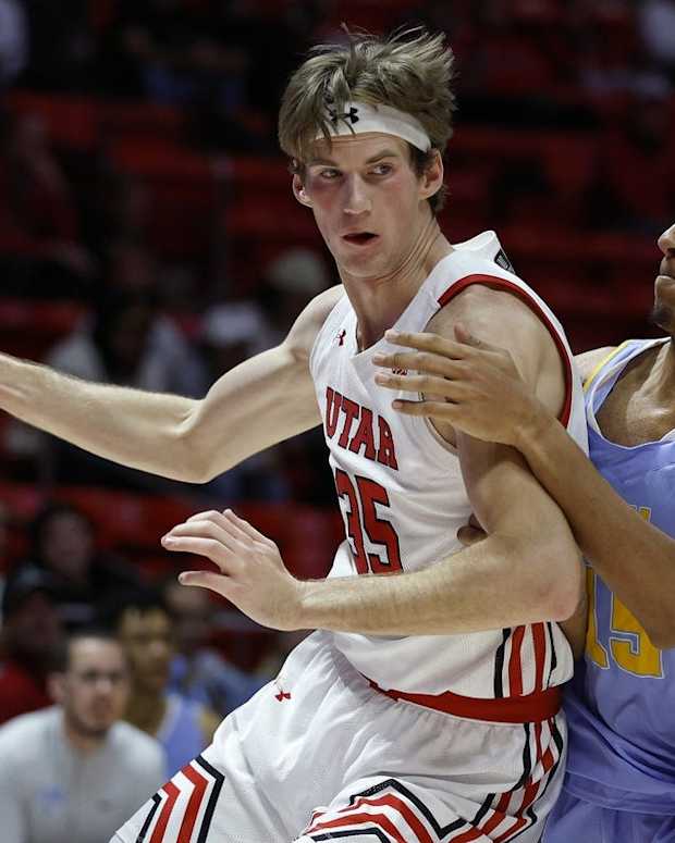 Nov 7, 2022; Salt Lake City, Utah, USA; Utah Utes center Branden Carlson (35) drives against LIU Sharks forward C.J. Delancy (15) in the first half at Jon M. Huntsman Center. Mandatory Credit: Jeffrey Swinger-USA TODAY Sports